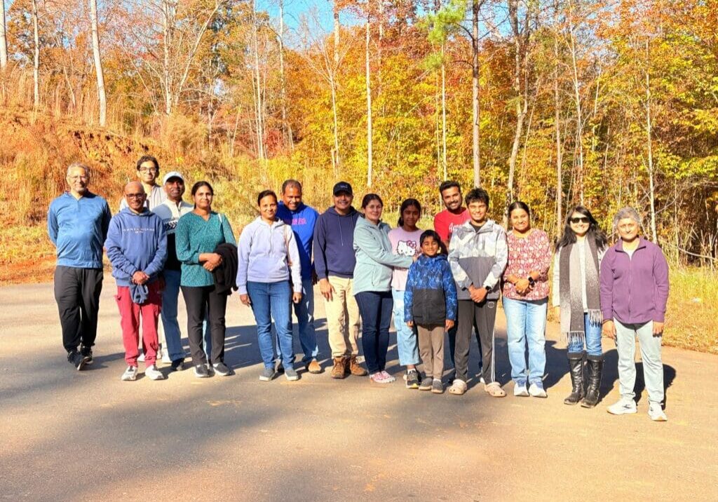 Group of people on autumn forest road